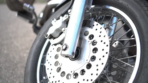 Camera movement from the wheel to the motorcycle Stock Footage 107723741