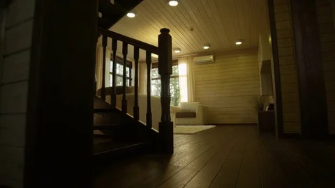 Camera Moves About Cottage Past Stairs to Living Room Vídeos de archivo 72857926