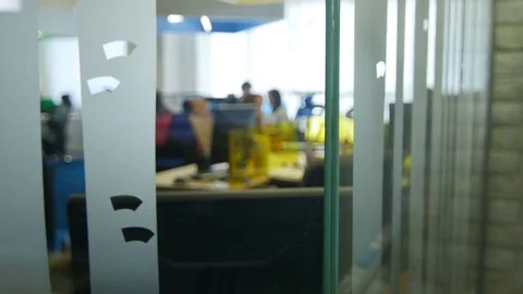 Camera Moves About Large Modern Room with Office Workers Stock Footage 73868918