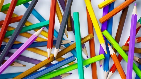 Camera moves above randomly scattered colored pencils on white background. 動画素材 119551943