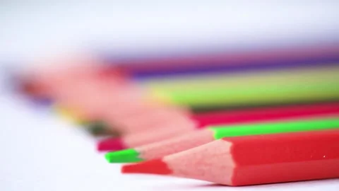 Camera moves above rows of colored pencils on white background. Endless coloring 動画素材 139357474