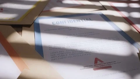 Camera moves across different classified labeled folders with secret information Stock Footage 221229882