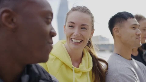 Camera moves across a diverse group of friends in conversation, in slow motion Video stock 108650291