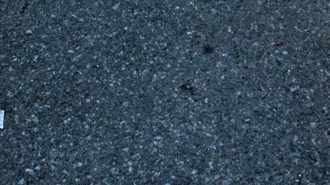 Camera moves along asphalt surface of road with a sharp transition to the sky Video stock 294624616