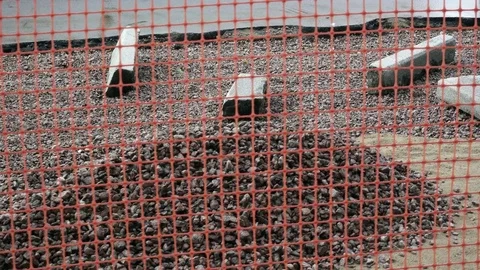 Camera moves along a barrier of the building site of repair of the road Video stock 82909687