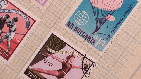 Camera  moves along the collection album with stamps, close up, macro Stock Footage 126759130