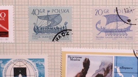 Camera  moves along the collection album with stamps, close up, macro Video stock 126759405