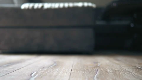 The camera moves along the floor, covered with laminated parquet with a woode Stock Footage 138876106