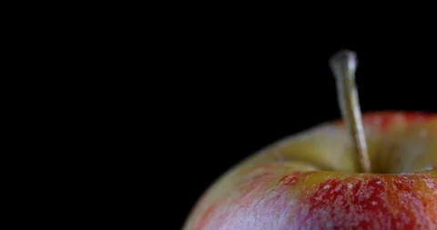 The camera moves along a fresh apple Stock Footage 129371376