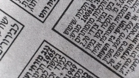 Camera moves along the Hebrew newspaper text, close up, macro view, slider movin Stock Footage 126758639