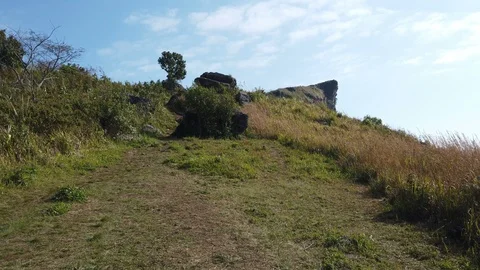 Camera moves along on mountain path slow motion Stock Footage 104153318