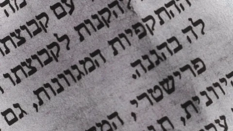 Camera moves along a newspaper sheet in Hebrew, macro view, slider moving Video stock 126758683