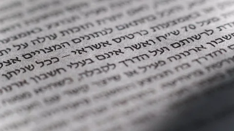 Camera moves along a newspaper sheet in Hebrew, macro view, slider moving 스톡 동영상 126758696