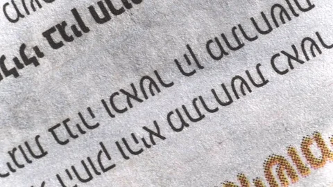 Camera moves along a newspaper sheet in Hebrew, macro view, slider moving Stock Footage 126758735