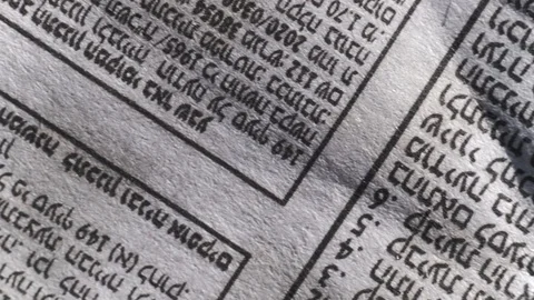 Camera moves along a newspaper sheet in Hebrew, macro view, slider moving Video stock 126758809