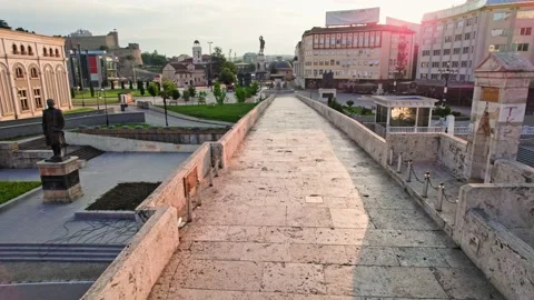 Camera moves along old bridge in Skopje, North Macedonia, in morning lights Stock Footage 157486431
