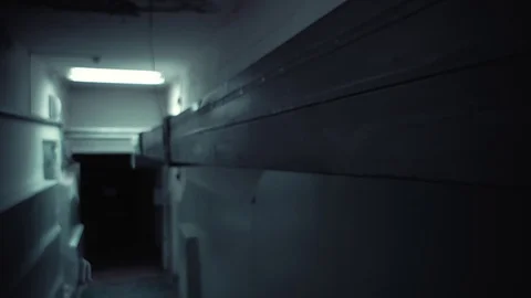 The camera moves along an old ventilation pipe in a dark basement. Stock Footage 121801978