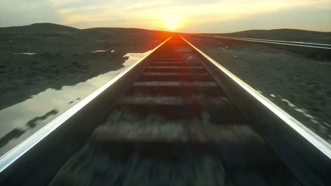 Camera moves along railway. Wonderful sunset. Realistic cinematic 4k animation. Stock Footage