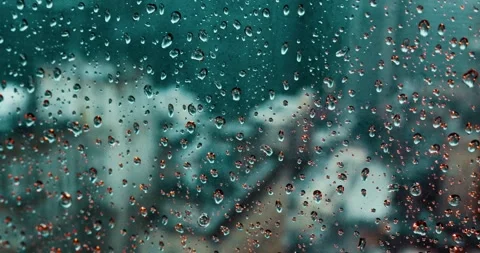 Camera Moves Along Skyscraper Window During Rainstorm in Modern City 스톡 동영상 323147026
