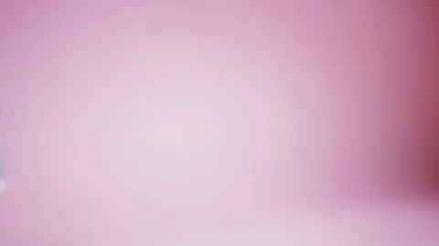 The camera moves along the sporting children's denim shoes standing on pink Stock Footage 112631212