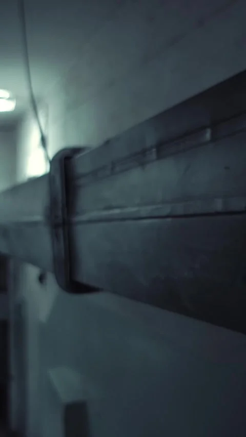 The camera moves along the ventilation box in the underground room. Stock Footage 269542376