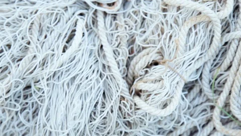 Camera moves along the white old tangled fishing net close-up Stock Footage 109607181