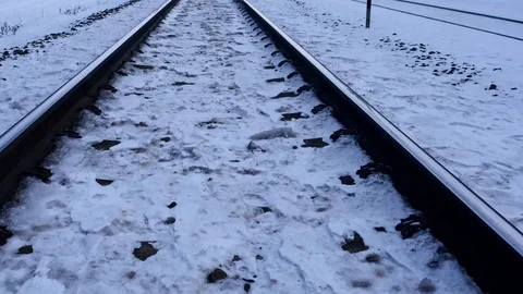 Camera moves along winter railway road time lapse from bottom to horizon Stock Footage 86654539