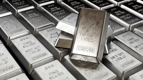 Camera moves and rotates around large stack of silver ingots Stock Footage 285605984