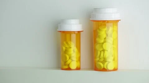 Camera moves up and stops on the bottles of pills Stock Footage 62184245