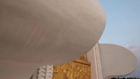 Camera moves around the buddah statue in big stupa. Dolly shot Video stock 76167086