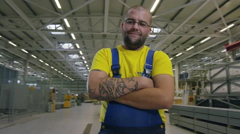 Camera moves around factory worker in warehouse Stock Footage 63031907