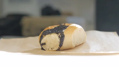 Camera moves around fruit kolache on paper in sunlight Stock Footage 93369012