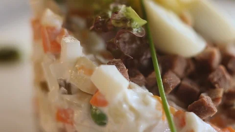 Camera moves around a Russian salad.Close-up.Macro. Stock Footage 123885345