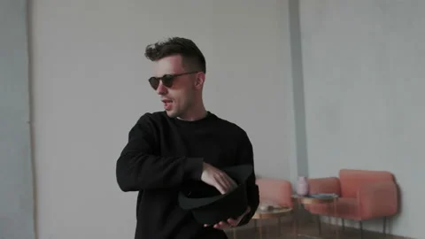 Camera moves around stylish dancing man on 360 degree. He dancing modern cool Stock Footage 107815248