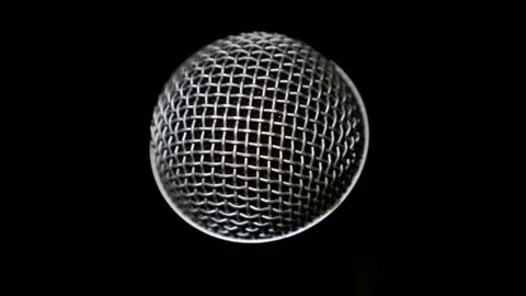 Camera moves around vocal microphone in recording studio, close-up. Dynamic Stock Footage 310724477