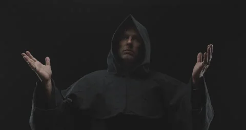 Camera Moves Away From a Monk With His Hands Held Up Video stock 156198569