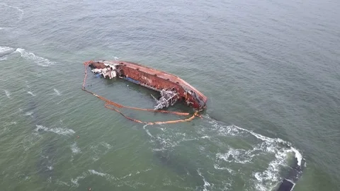 Camera moves away wrecked ship into clouds Stock Footage 121927363