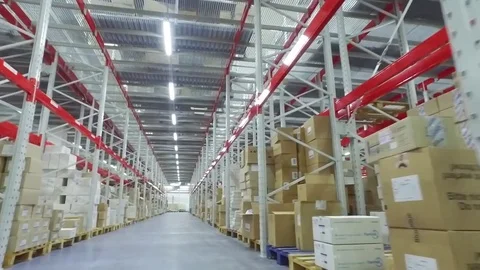 Camera moves between shelves with cardboard boxes in storage warehouse HD video Stock Footage 72219418