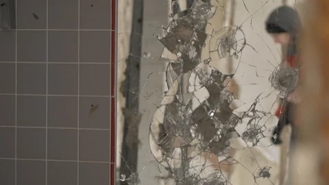 Camera moves to broken mirror where mysterious man figure appears Stock Footage 88290233