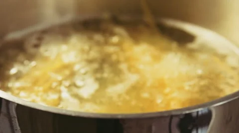 Camera moves close to the cooking pot with spaghetti cooks in boiling water Stock Footage 65524534