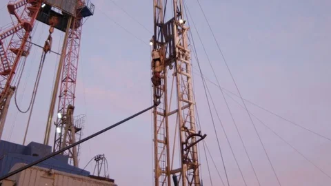 Camera Moves down to Crane Bottom and Workers Controlling Stock Footage 79208699