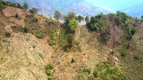 Camera moves down from hill top along steep slope Video stock 104170923