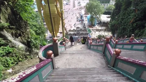Camera moves downstairs from Main Temple cave, Batu caves, Kuala Lumpur Video stock 197375342