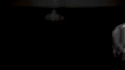 The camera moves to the edge of a glass of wine slow mo Stock Footage 86688322