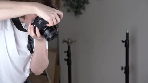 Camera moves in focus with phtographer in a studio Stock Footage 270092575