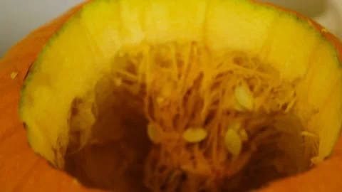 The camera moves forward and shows the inside of the pumpkin. Halloween Stock Footage 219256212
