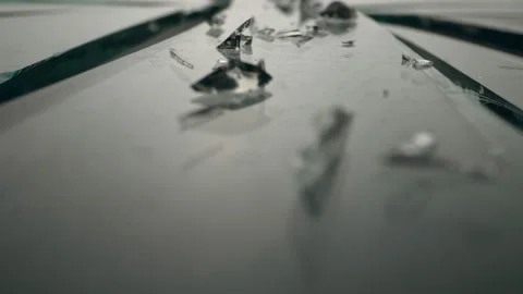 The camera moves forward over the shards of broken glass Stock Footage 143849036