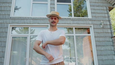 Camera moves forward on portrait of young happy stylish millennial hipster with Stock Footage 167776058