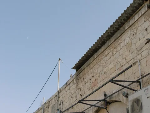 The camera moves forward on the roofs of the Old City of Jaffa, Israel. REC709 Vídeo Stock 83784042