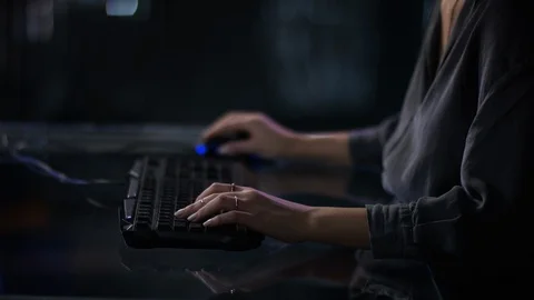 Camera moves from her hands up to beautiful girls illuminated face Video stock 101253727